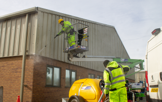 A photograph of two of Fizzco Maintenance's Technicians, performing maintenance on Lincoln Enterprise Park.