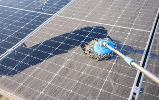 Cleaning and Maintenance being carried out on some Solar Panels to improve their efficiency during the summer months.