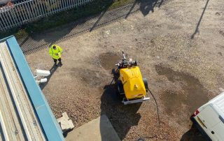 A view from the top of a factory whilst performing essential maintenance up high.